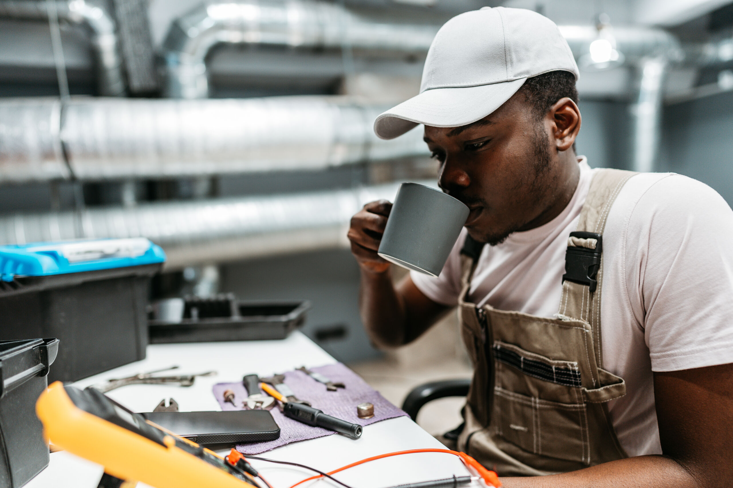 young-man-enjoying-a-coffee-break-while-working